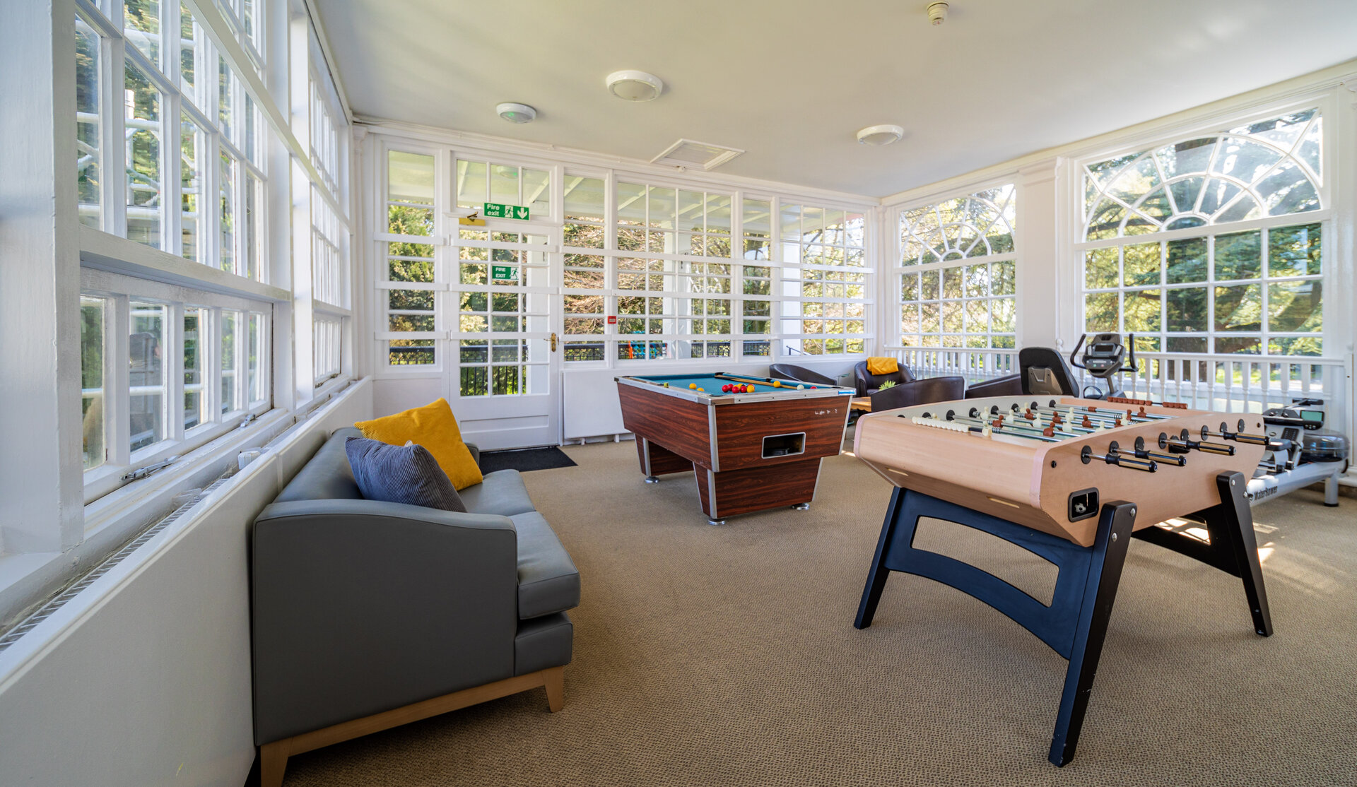 Aderyn Hospital communal area with games and exercise equipment