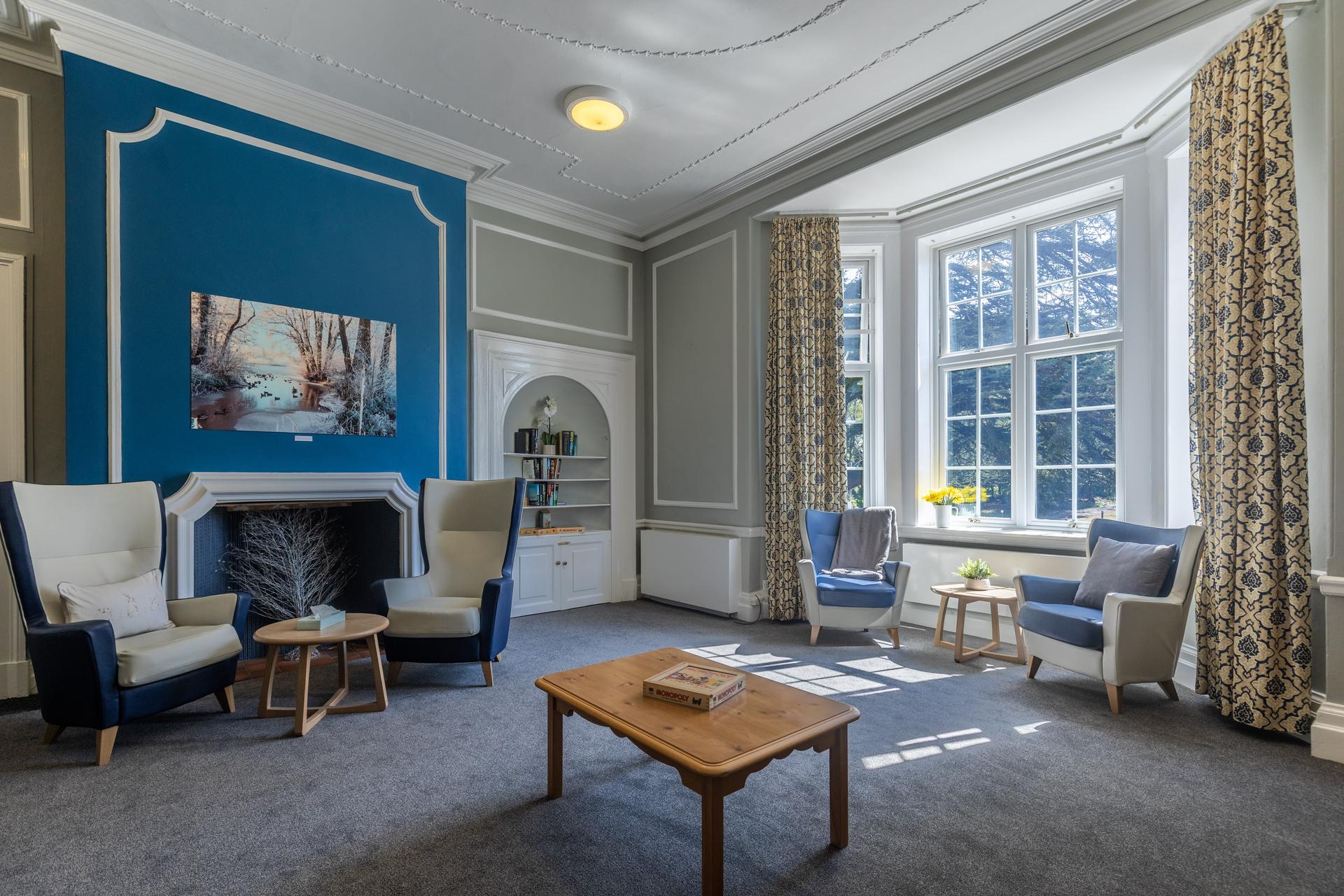 Communal area of Aderyn with large, comfy seats and tables