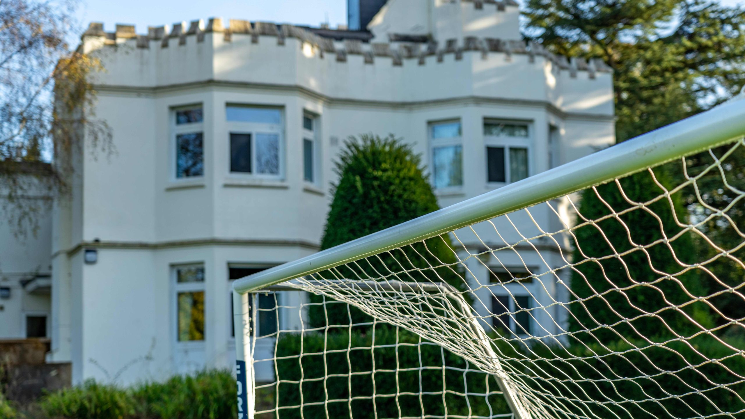 Close up of a goal post in front of Sturt House building