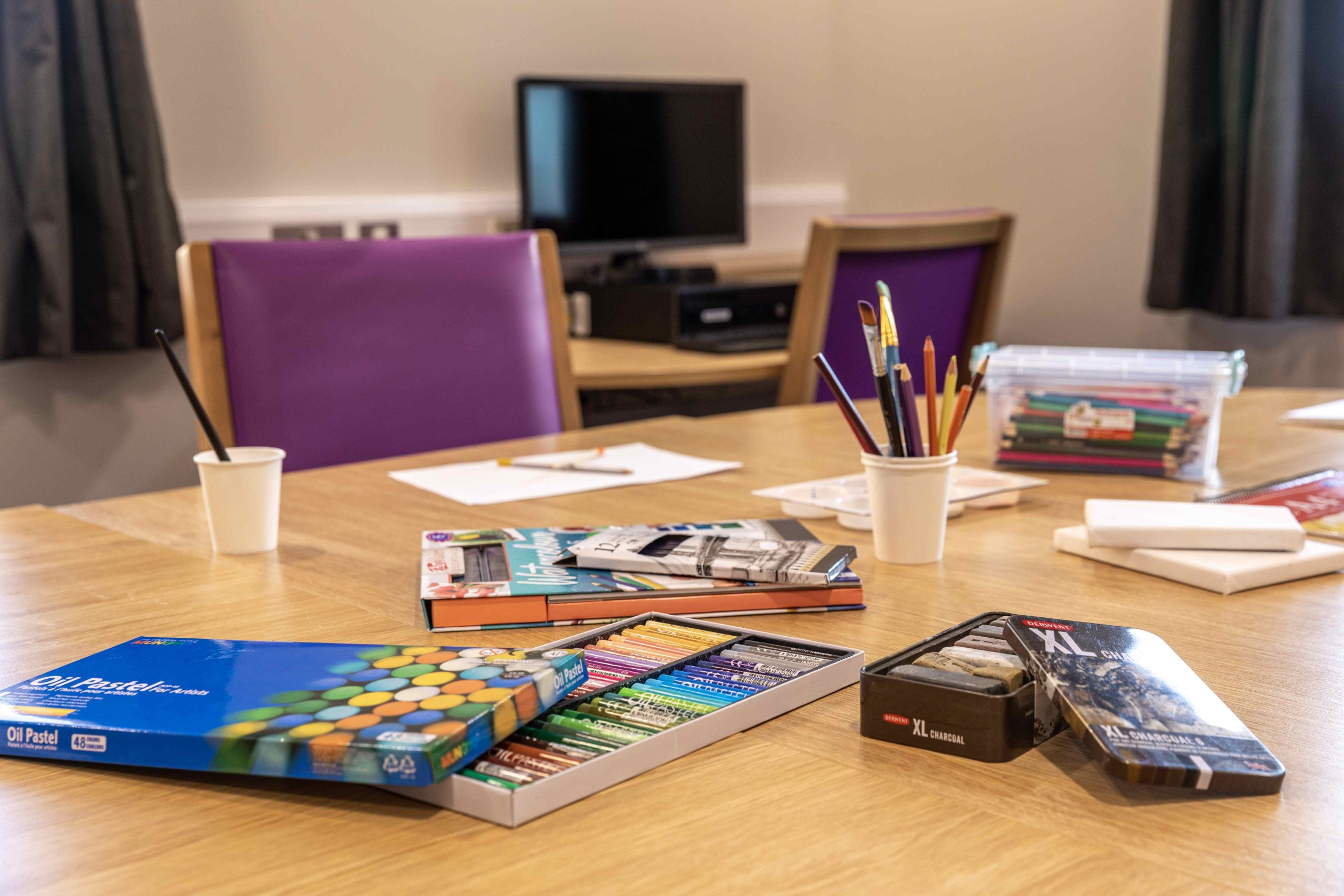 Art supplies on a table at The Copse