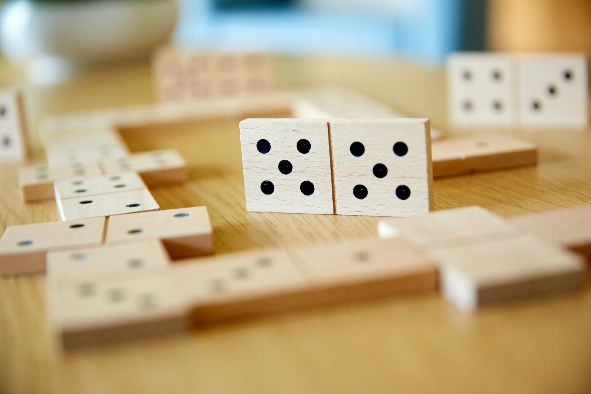 A close up of some dominoes in play on a table
