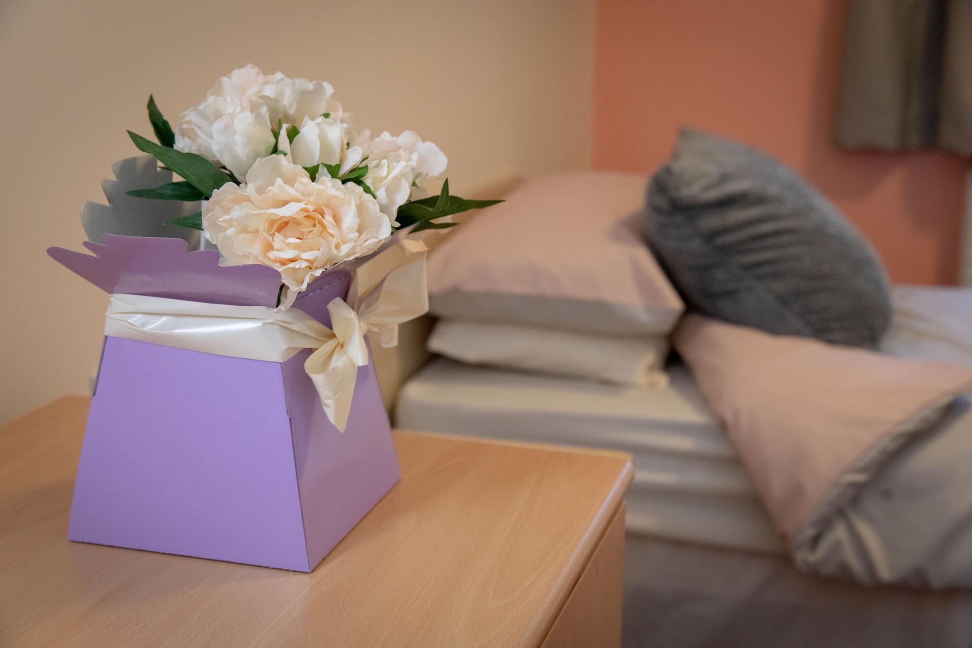 Flowers on a bedside table at Ty Gwyn Hall