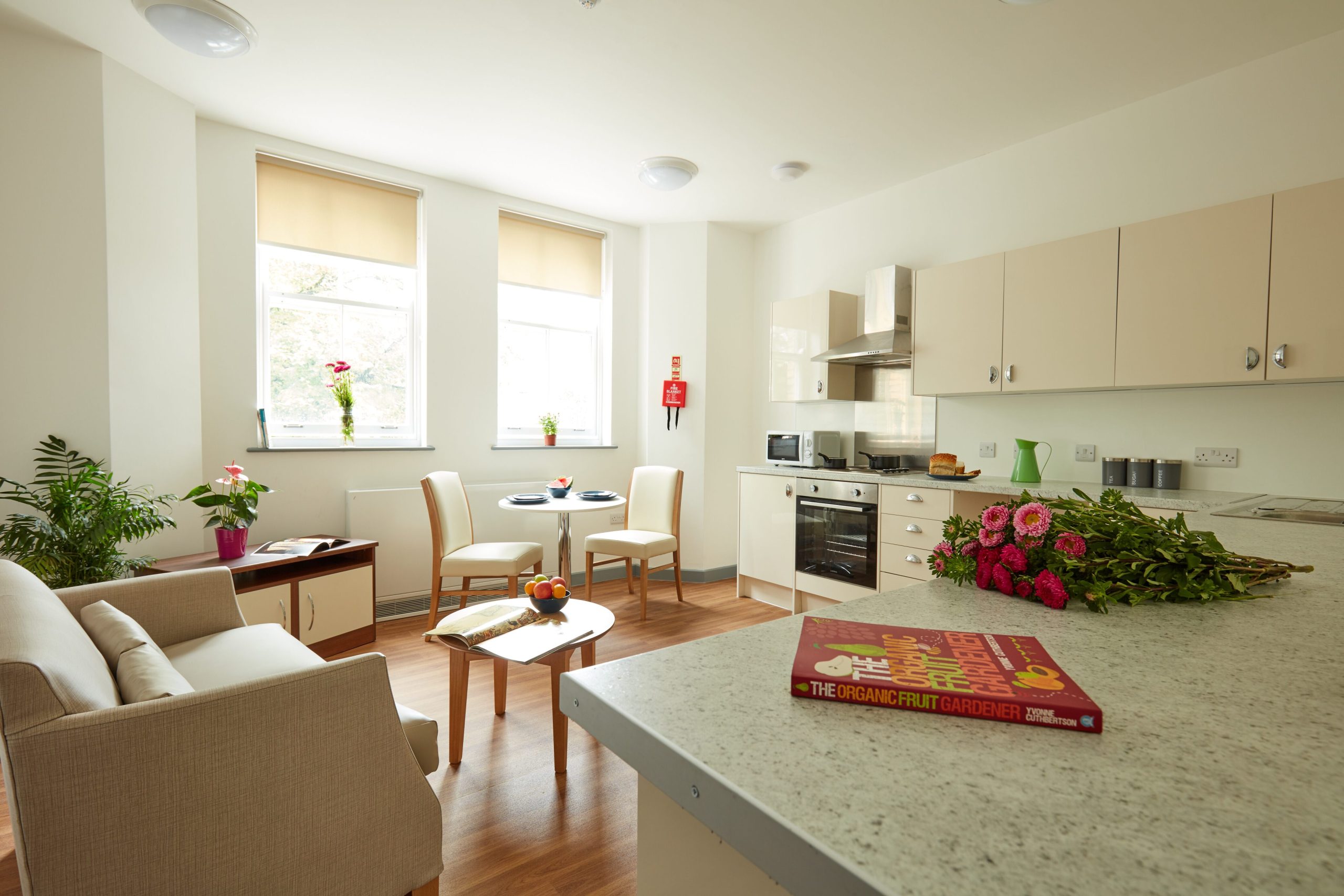 A kitchen and lounge area at Victoria Gardens