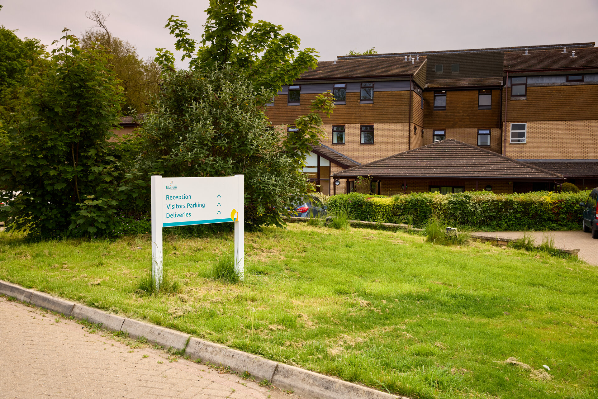 Exterior wide shot of Avonfield Neurological Centre including the sign