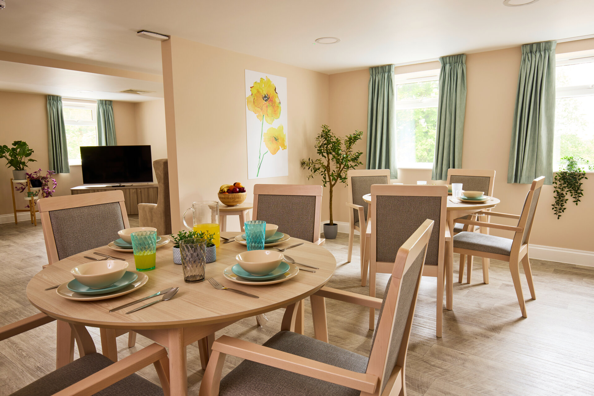 Comfortable dinning area with mutple tables and chairs for services users at Avonfield Neurological Centre